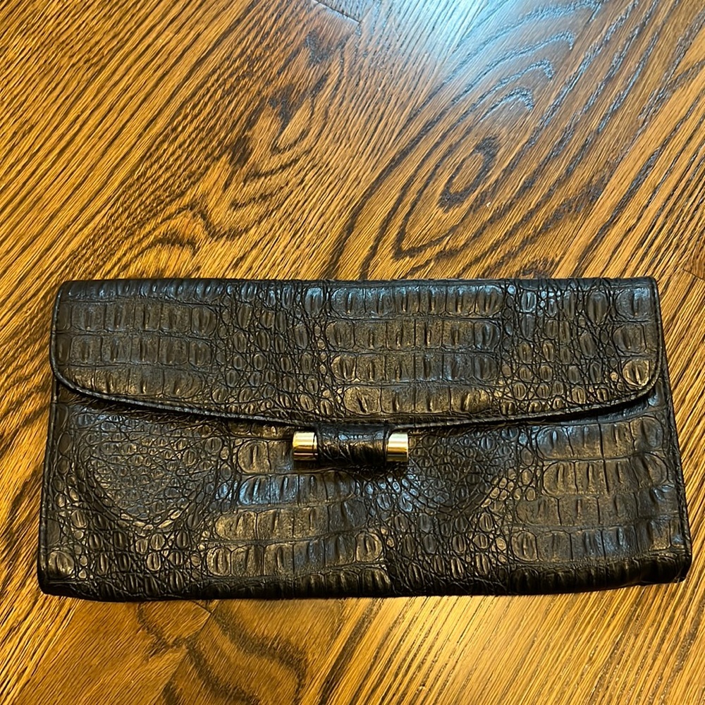 Black Envelope Clutch with silver hardware. Canvas lined. Snap close.
